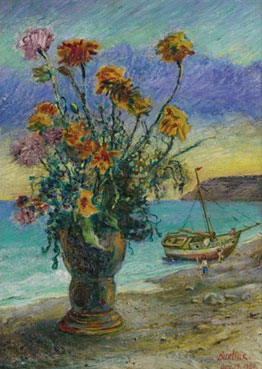 Flowers in a vase near a beach