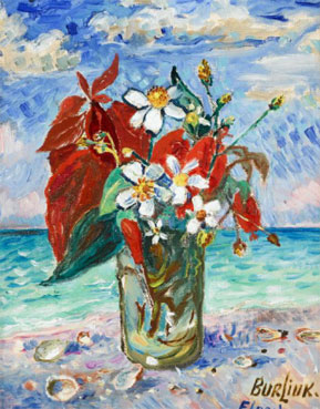 Vase of flowers on the beach